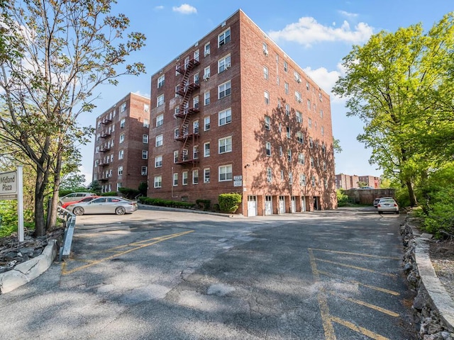 1234 Midland Ave Unit 5C, Bronxville, NY 10708 - view of apartment building / complex featuring uncovered parking