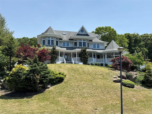 20 Frost Valley Rd, Mount Sinai, NY 11766 - view of front of home with a porch and a front lawn