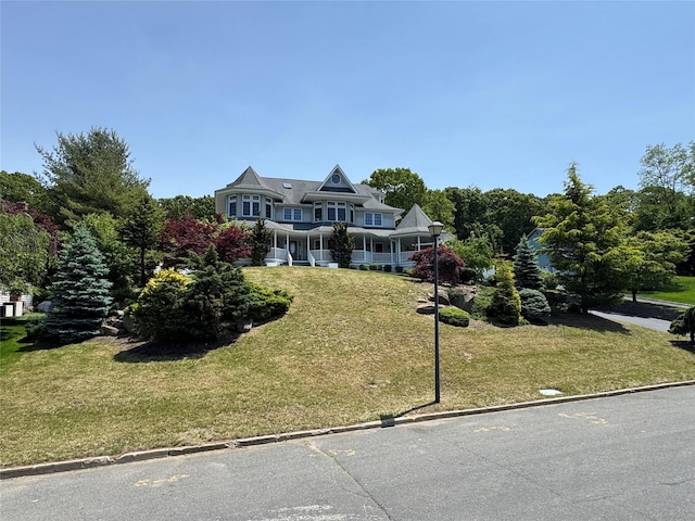 20 Frost Valley Rd, Mount Sinai, NY 11766 - view of front of property featuring a front lawn and a porch