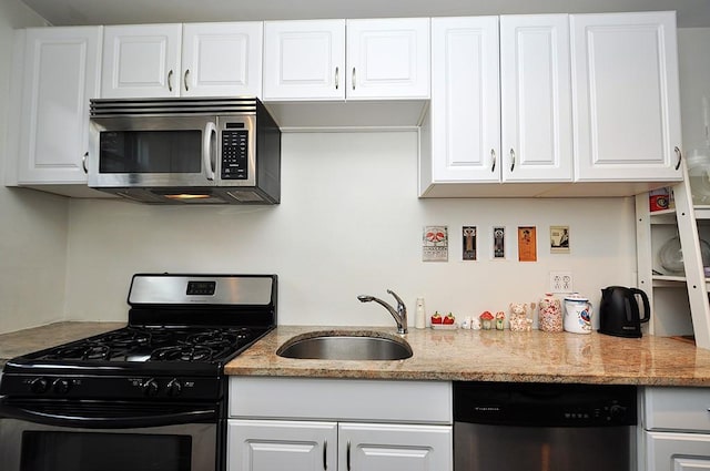 142 Garth Rd Unit 1A, Scarsdale, NY 10583 - kitchen with stainless steel appliances, a sink, and white cabinetry