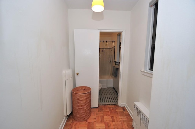 142 Garth Rd Unit 1A, Scarsdale, NY 10583 - hallway with radiator heating unit and baseboards