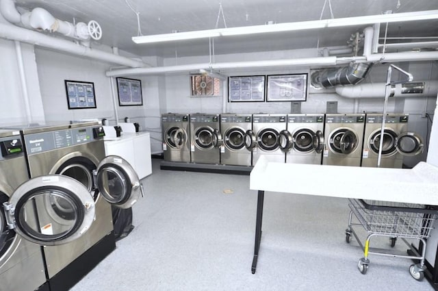 142 Garth Rd Unit 1A, Scarsdale, NY 10583 - shared laundry room featuring washing machine and clothes dryer