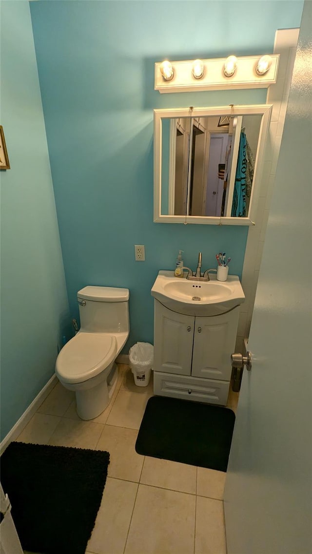 1 E Broadway Unit 3R, Long Beach, NY 11561 - bathroom featuring tile patterned flooring, vanity, toilet, and baseboards
