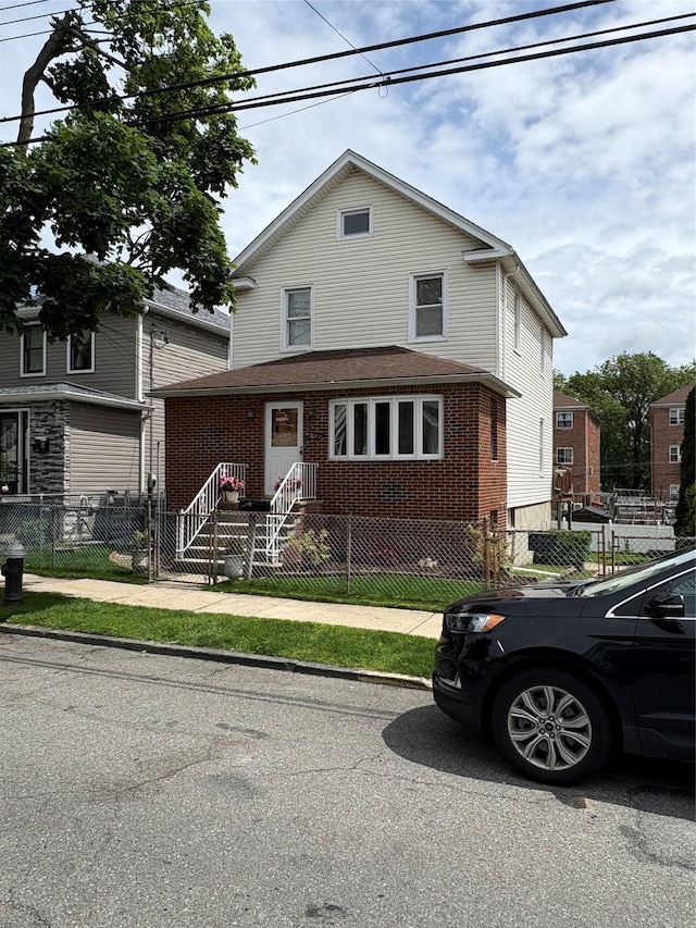 840 Hollywood Ave, Bronx, NY 10465 - view of front facade featuring brick siding and a fenced front yard