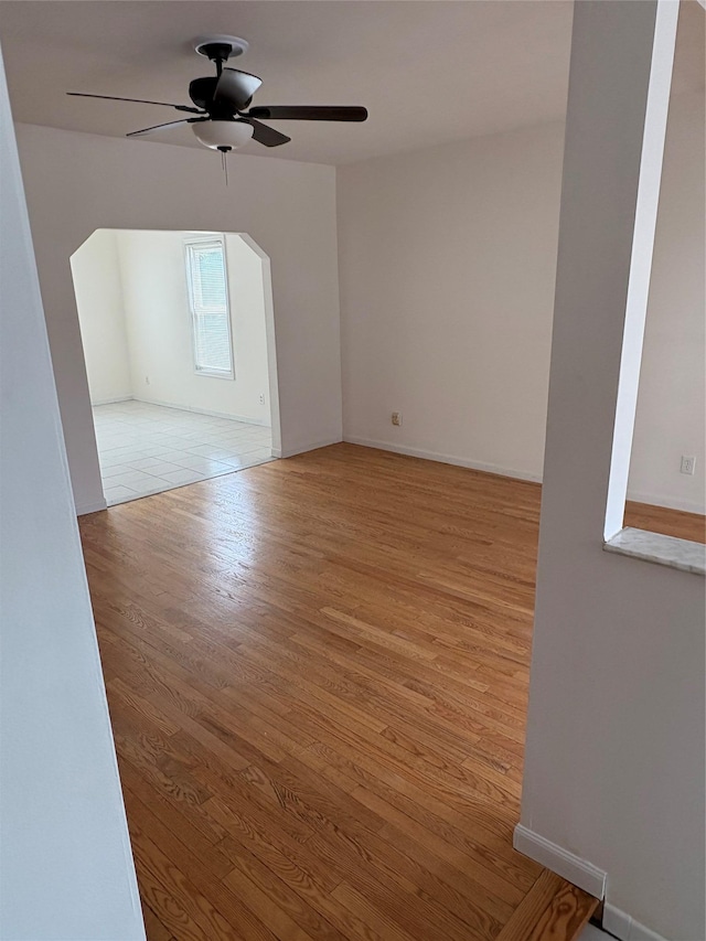 840 Hollywood Ave, Bronx, NY 10465 - spare room with light wood-style flooring, ceiling fan, and baseboards