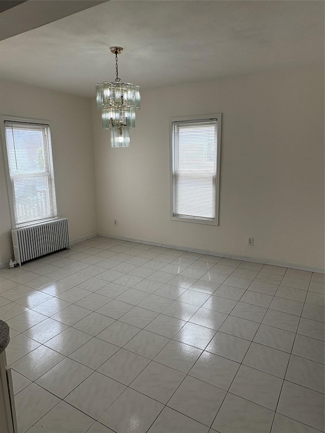 840 Hollywood Ave, Bronx, NY 10465 - unfurnished room with radiator heating unit, plenty of natural light, a chandelier, and light tile patterned floors