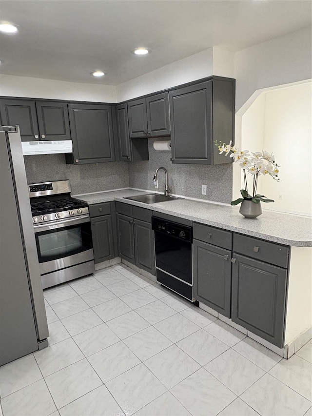 840 Hollywood Ave, Bronx, NY 10465 - kitchen with stainless steel appliances, a sink, under cabinet range hood, light countertops, and gray cabinetry