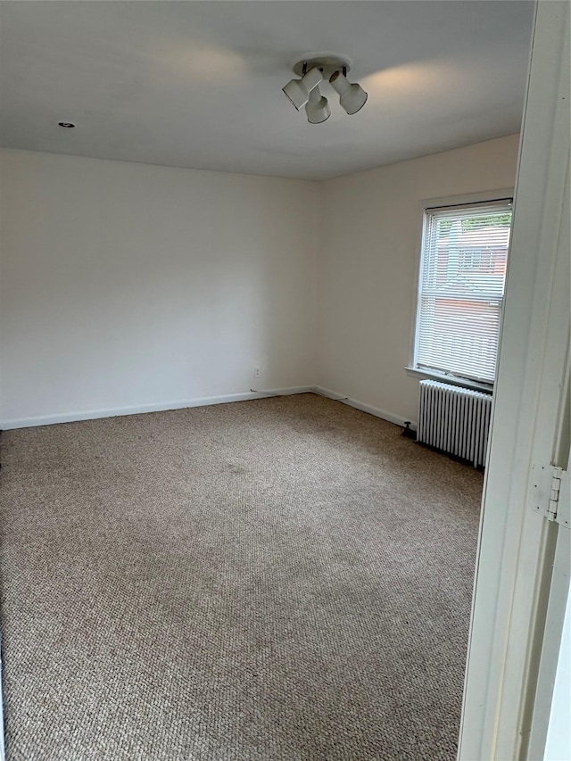 840 Hollywood Ave, Bronx, NY 10465 - empty room with radiator, carpet floors, and baseboards