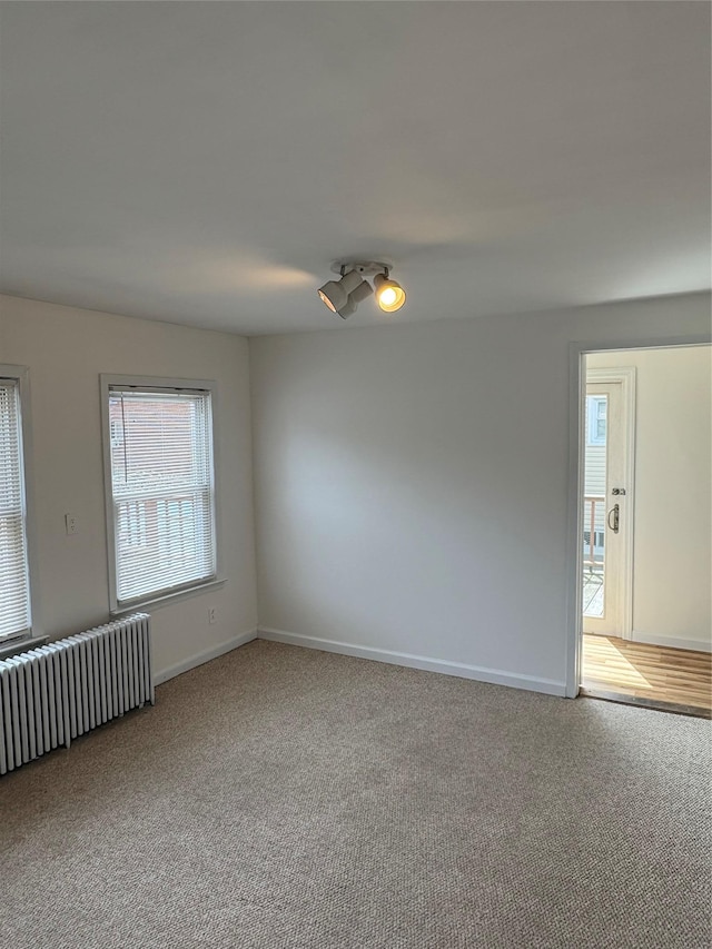 840 Hollywood Ave, Bronx, NY 10465 - spare room featuring radiator heating unit, carpet, and baseboards