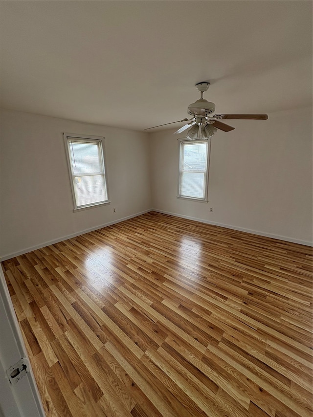 840 Hollywood Ave, Bronx, NY 10465 - unfurnished room with plenty of natural light, light wood-type flooring, ceiling fan, and baseboards