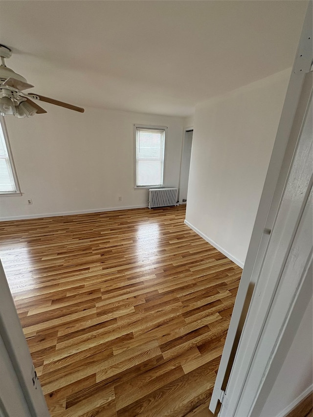 840 Hollywood Ave, Bronx, NY 10465 - spare room with radiator, a ceiling fan, wood finished floors, and baseboards