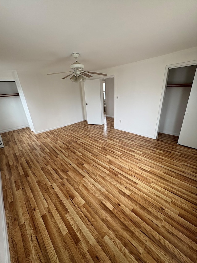 840 Hollywood Ave, Bronx, NY 10465 - unfurnished bedroom with light wood-style flooring, ceiling fan, and baseboards