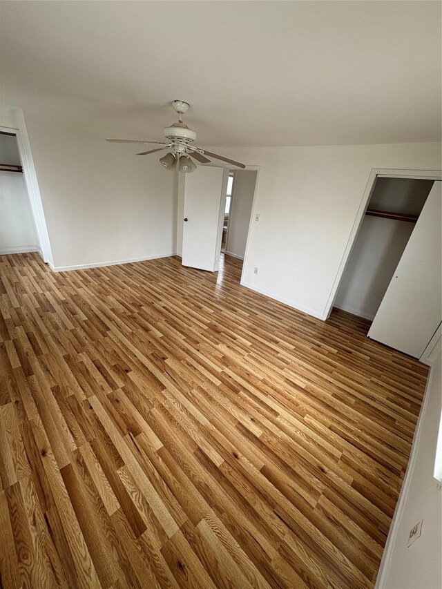 840 Hollywood Ave, Bronx, NY 10465 - unfurnished living room with light wood-type flooring, ceiling fan, and baseboards