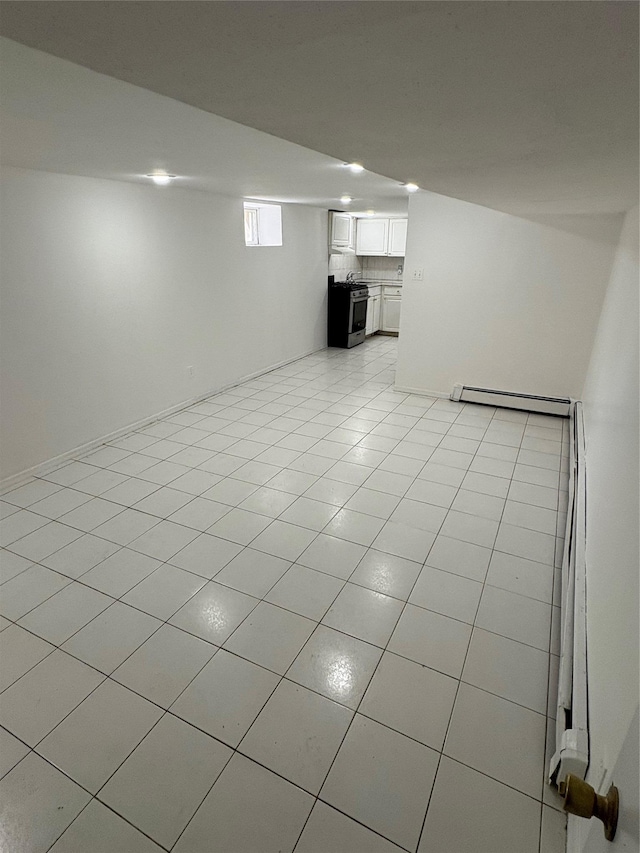 840 Hollywood Ave, Bronx, NY 10465 - basement with baseboard heating and light tile patterned flooring