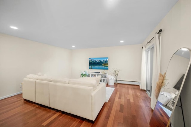 67 Richmond Blvd Unit 2A, Ronkonkoma, NY 11779 - living room with a baseboard heating unit, wood finished floors, and recessed lighting