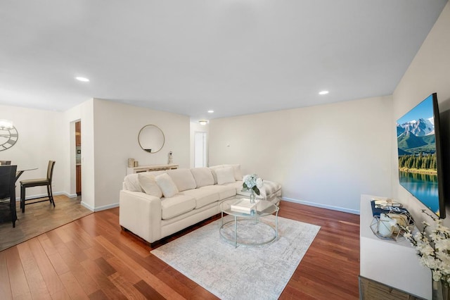 67 Richmond Blvd Unit 2A, Ronkonkoma, NY 11779 - living room featuring dark wood-style floors, baseboards, and recessed lighting