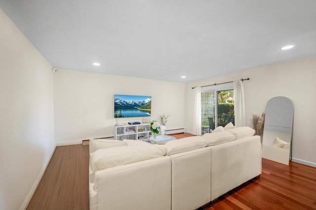 67 Richmond Blvd Unit 2A, Ronkonkoma, NY 11779 - living room featuring baseboard heating, wood finished floors, recessed lighting, and baseboards