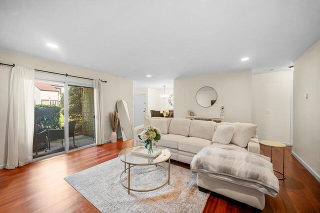 67 Richmond Blvd Unit 2A, Ronkonkoma, NY 11779 - living room with wood finished floors, baseboards, a chandelier, and recessed lighting