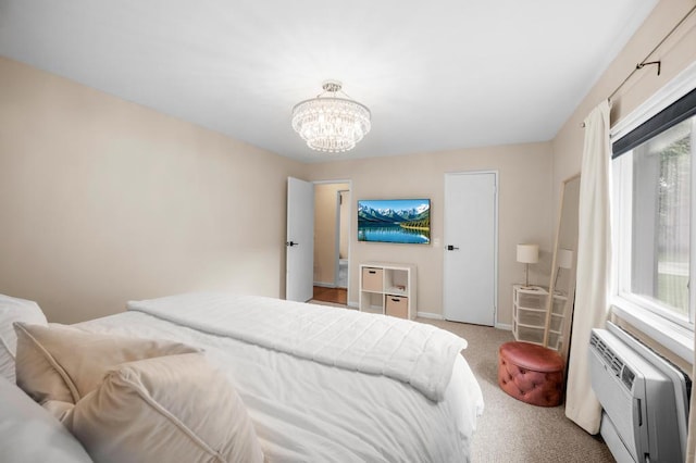 67 Richmond Blvd Unit 2A, Ronkonkoma, NY 11779 - carpeted bedroom featuring a chandelier, baseboards, and a wall mounted AC