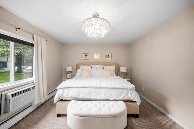 67 Richmond Blvd Unit 2A, Ronkonkoma, NY 11779 - bedroom with carpet floors, a chandelier, and baseboards