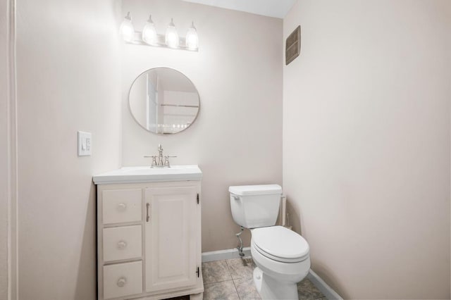 67 Richmond Blvd Unit 2A, Ronkonkoma, NY 11779 - bathroom with toilet, vanity, baseboards, and tile patterned flooring