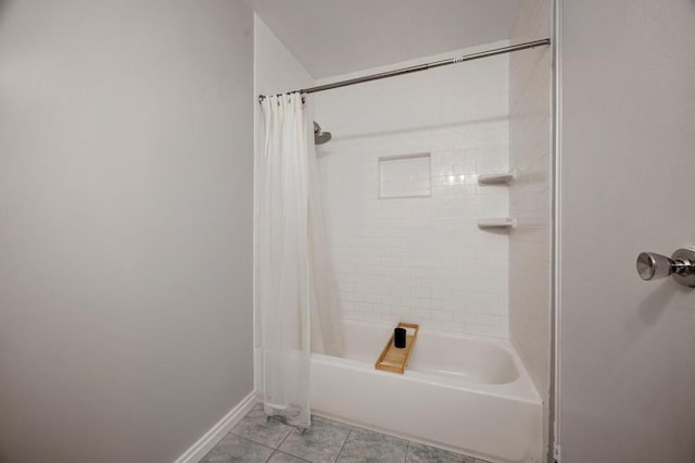 67 Richmond Blvd Unit 2A, Ronkonkoma, NY 11779 - bathroom featuring shower / tub combo with curtain, baseboards, and tile patterned flooring