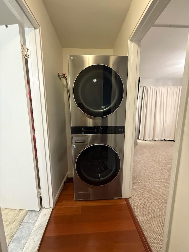 67 Richmond Blvd Unit 2A, Ronkonkoma, NY 11779 - laundry room featuring stacked washer and clothes dryer and wood finished floors