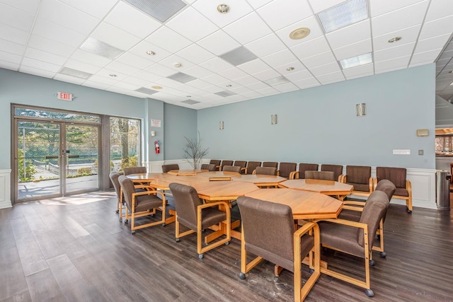 67 Richmond Blvd Unit 2A, Ronkonkoma, NY 11779 - dining room featuring dark wood finished floors, a wainscoted wall, and a drop ceiling