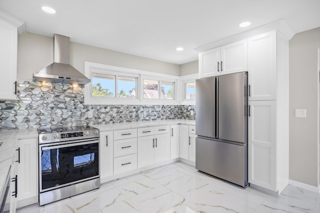 2 Starlight Ln, Levittown, NY 11756 - kitchen with stainless steel appliances, wall chimney range hood, recessed lighting, decorative backsplash, and light marble finish floors