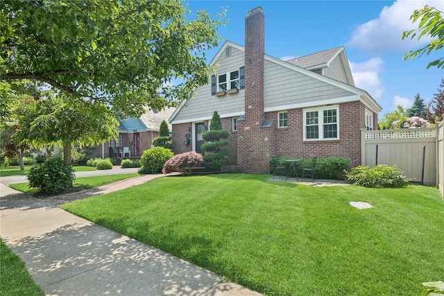 66 Wyandanch Ave, Babylon, NY 11702 - view of front of house with brick siding and a chimney