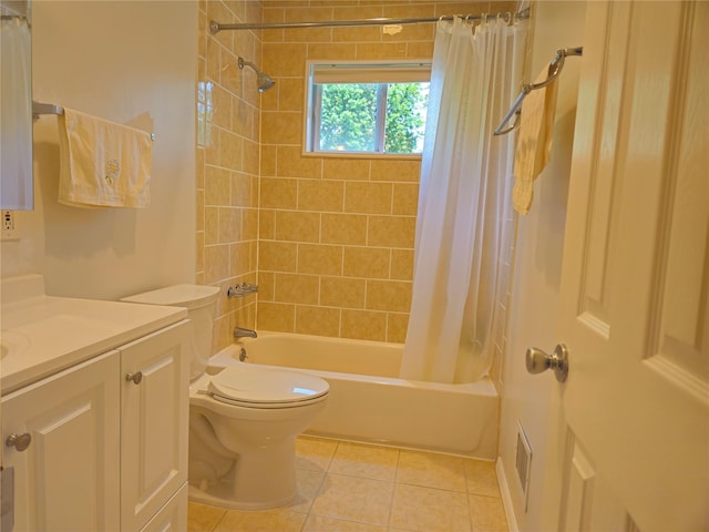 bathroom with vanity, tile patterned flooring, shower / tub combo, and toilet