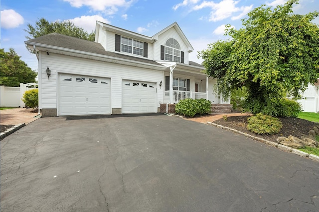 8 Tecumseh Ct, Commack, NY 11725 - traditional-style house with covered porch, driveway, and a garage