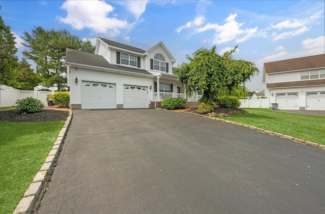 8 Tecumseh Ct, Commack, NY 11725 - traditional-style house featuring asphalt driveway and covered porch