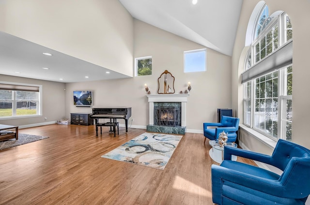 8 Tecumseh Ct, Commack, NY 11725 - living room featuring a fireplace, high vaulted ceiling, wood finished floors, baseboards, and recessed lighting