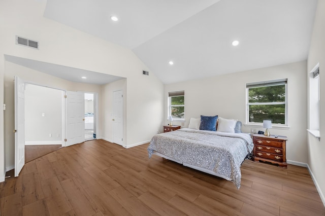 8 Tecumseh Ct, Commack, NY 11725 - bedroom with wood finished floors, multiple windows, vaulted ceiling, baseboards, and recessed lighting