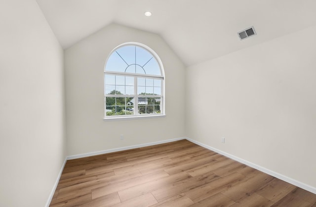 8 Tecumseh Ct, Commack, NY 11725 - spare room featuring light wood-style flooring, lofted ceiling, baseboards, and recessed lighting