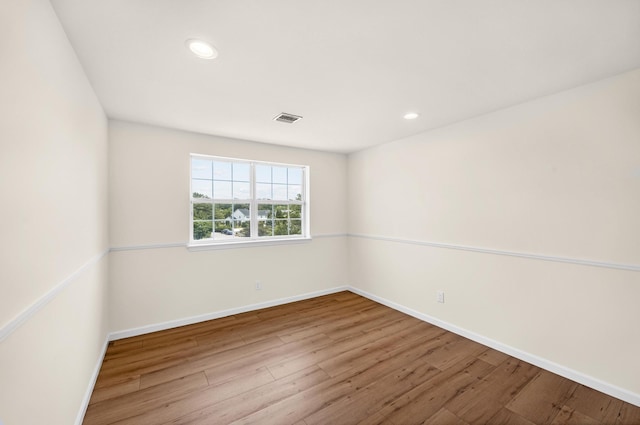 8 Tecumseh Ct, Commack, NY 11725 - unfurnished room with wood finished floors, baseboards, and recessed lighting