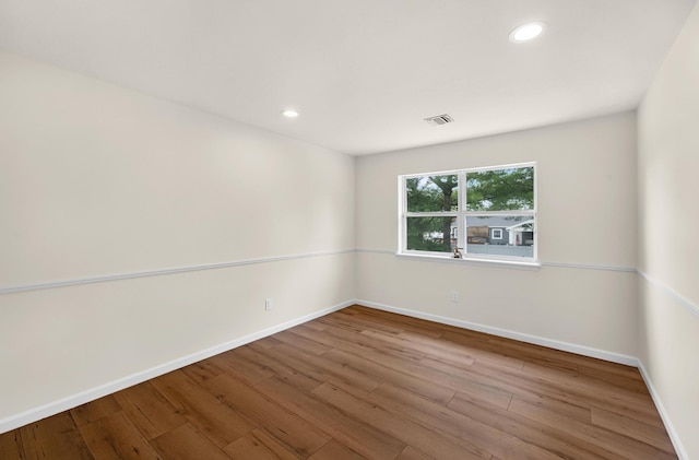 8 Tecumseh Ct, Commack, NY 11725 - empty room with wood finished floors, baseboards, and recessed lighting