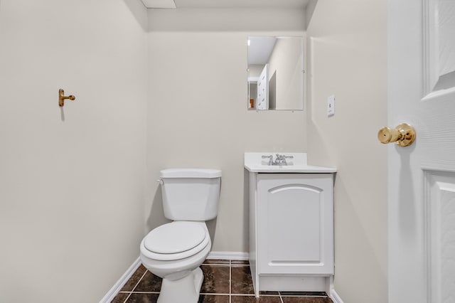 8 Tecumseh Ct, Commack, NY 11725 - half bath with baseboards, toilet, vanity, and tile patterned floors