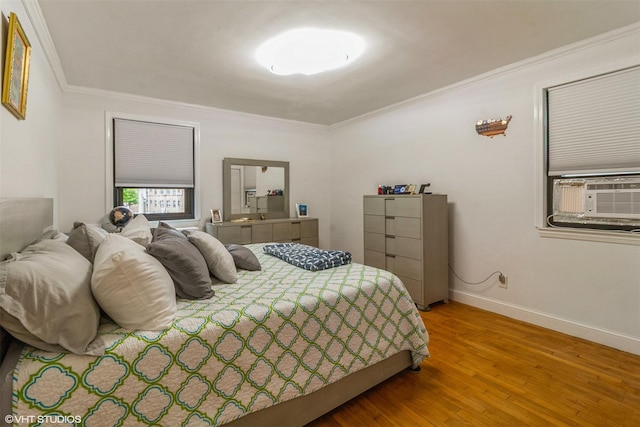 17 Lawrence Dr Unit A, White Plains, NY 10603 - bedroom featuring wood finished floors, ornamental molding, cooling unit, and baseboards