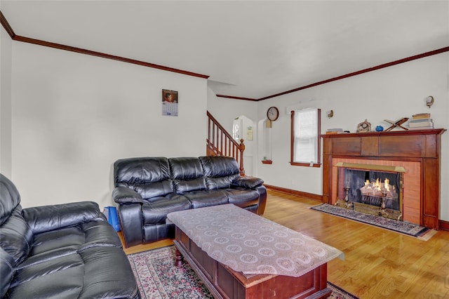62 Herman Blvd, Franklin Square, NY 11010 - living room with light wood finished floors, stairway, a tile fireplace, ornamental molding, and baseboards