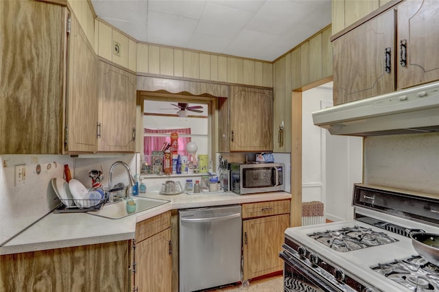 62 Herman Blvd, Franklin Square, NY 11010 - kitchen featuring stainless steel appliances, a sink, under cabinet range hood, light countertops, and a ceiling fan