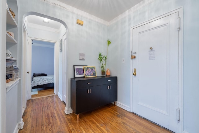 84-49 168th St Unit 6L, Jamaica Hills, NY 11432 - foyer featuring hardwood / wood-style flooring, arched walkways, and ornamental molding
