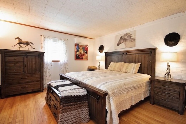 3060 State Route 17b, Cochecton, NY 12726 - bedroom with light wood-style flooring, an AC wall unit, and crown molding