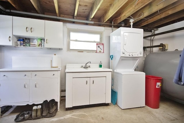 3060 State Route 17b, Cochecton, NY 12726 - washroom featuring estacked washer and dryer, cabinet space, and oil tank
