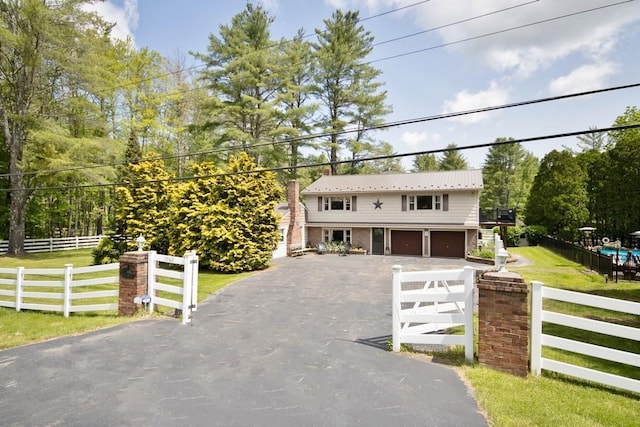 3060 State Route 17b, Cochecton, NY 12726 - view of front of property with asphalt driveway and a garage