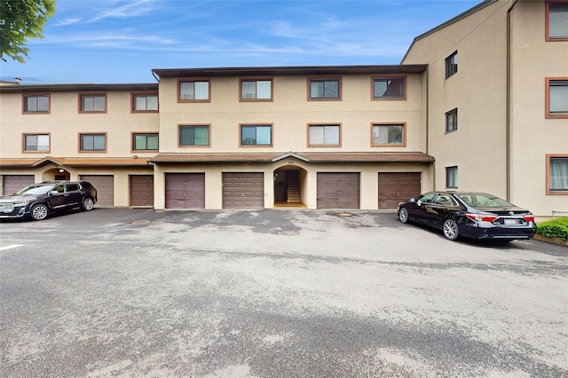5-16 115th Unit C, College Point, NY 11356 - view of building exterior with an attached garage and driveway