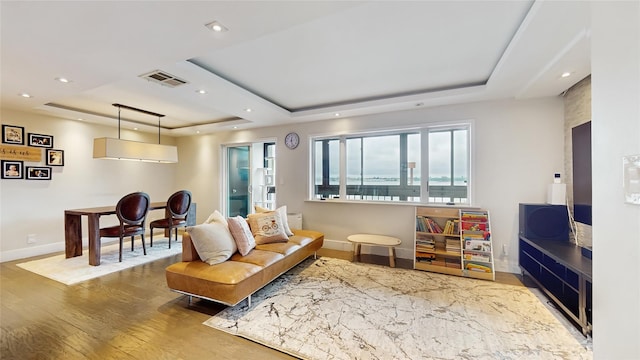 5-16 115th Unit C, College Point, NY 11356 - living area with a raised ceiling, wood finished floors, baseboards, and recessed lighting