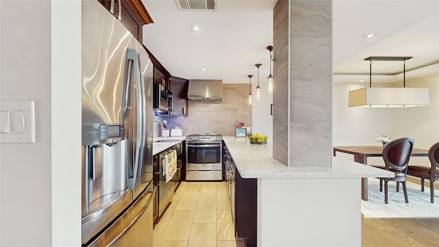 5-16 115th Unit C, College Point, NY 11356 - kitchen with stainless steel appliances, a sink, pendant lighting, light stone countertops, and a peninsula
