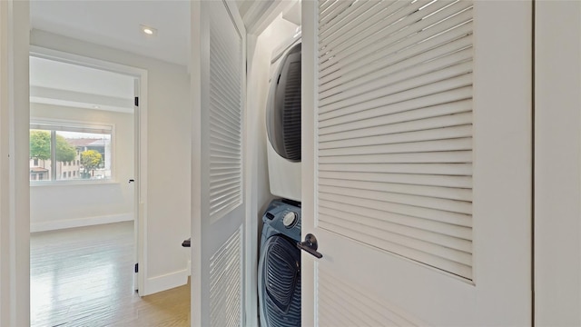 5-16 115th Unit C, College Point, NY 11356 - laundry room with stacked washer / drying machine, light wood-style flooring, baseboards, and recessed lighting